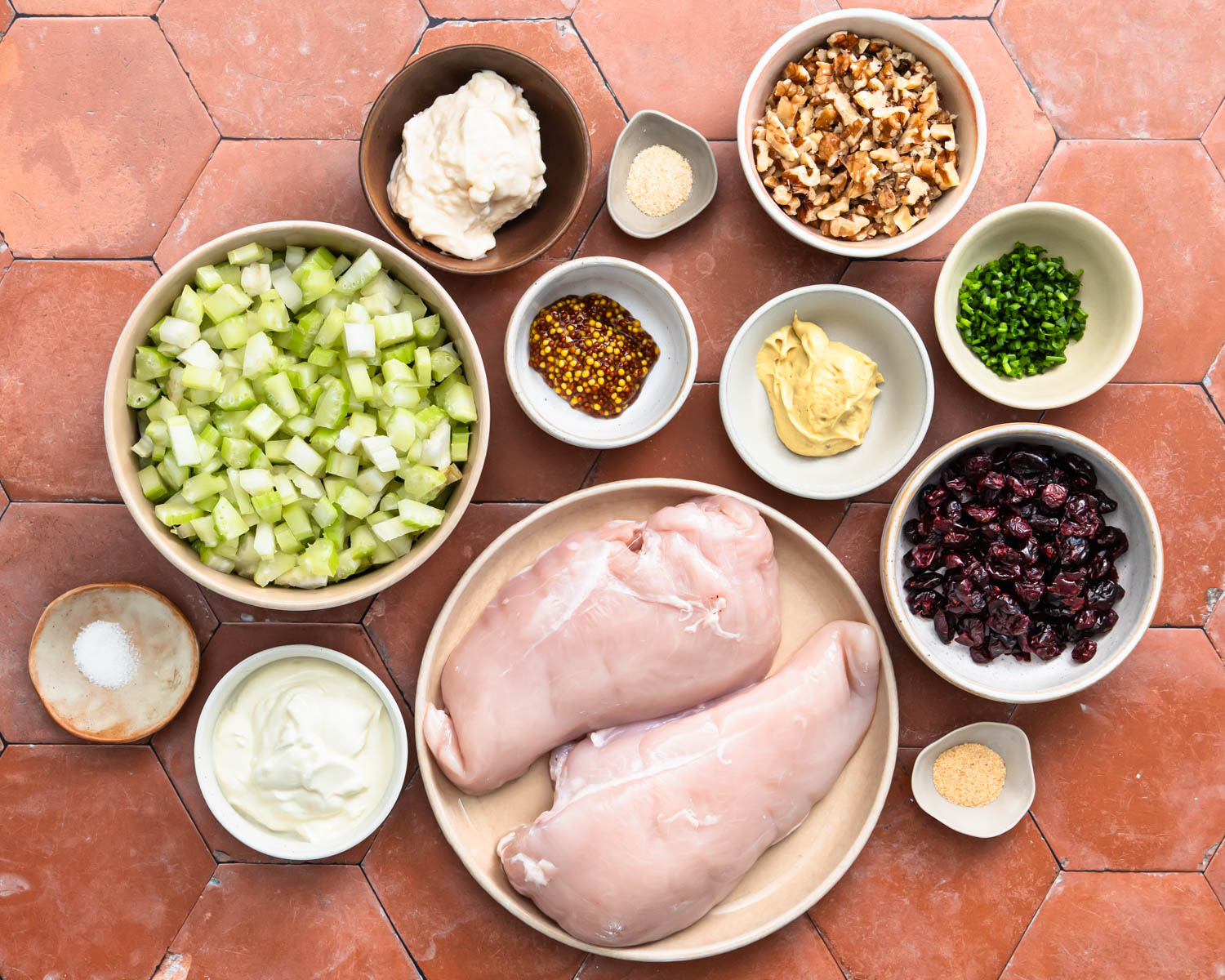 Ingredients needed to make cranberry chicken walnut salad.