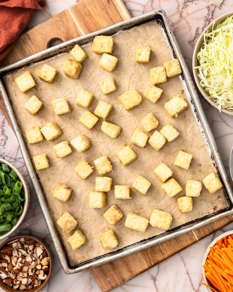 Crunchy tofu on a sheet pan after baking.