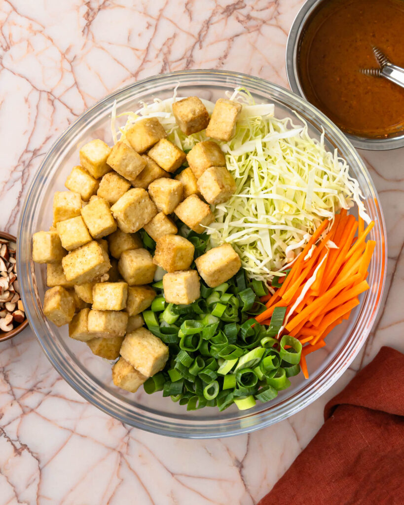 Tofu salad ingredients placed in a bowl before mixing with the dressing.