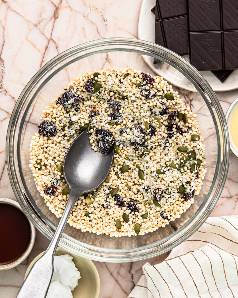 Ingredients for no bake energy bites added to a bowl. 