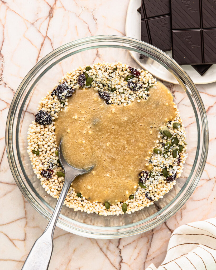 Tahini maple mixture added to the dry ingredients to make no bake energy bites. 