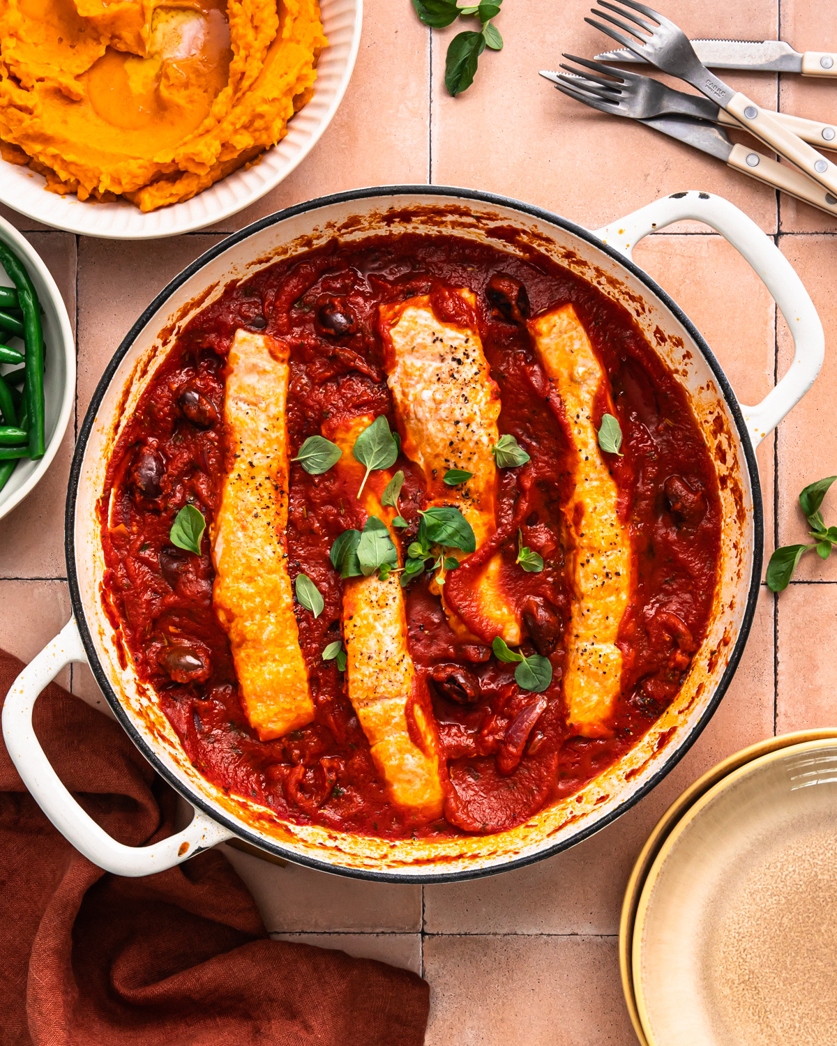 Salmon puttanesca in a pan. 
