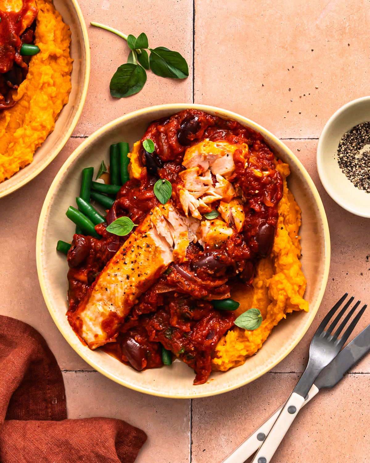 Salmon puttanesca in a bowl.