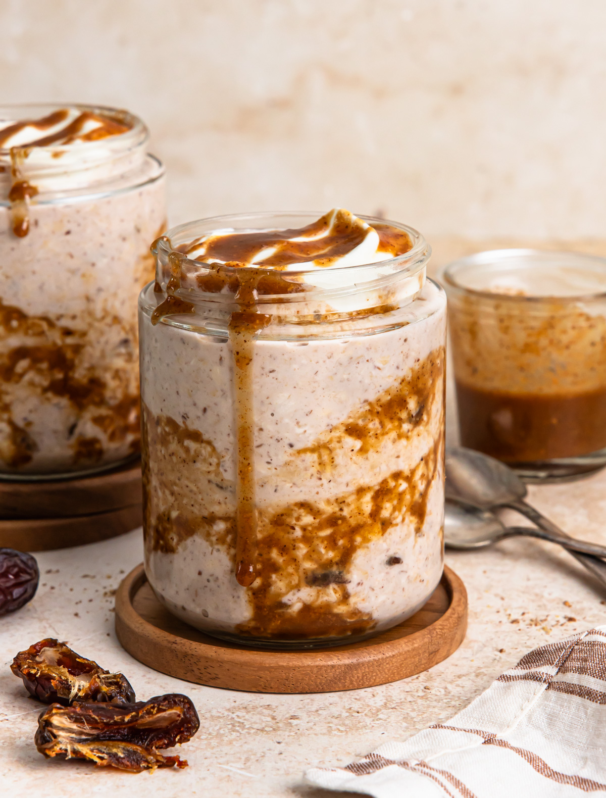 Close up of sticky date overnight oats in a jar.